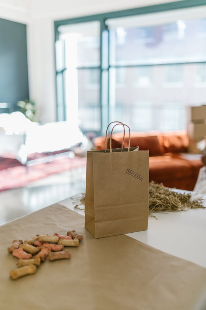 Brown paper bag with dog treats, ideal for small business showcasing eco-friendly packaging.